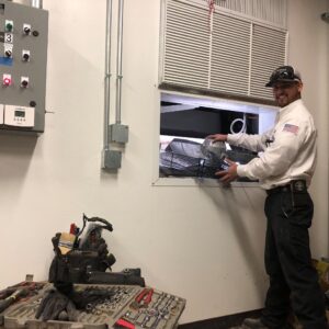 A technician installing a commercial or residential HVAC system.